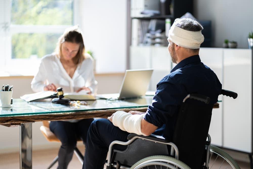 An SSDI lawyer and a disabled individual discuss compensation, legal options, and employment-related health coverage following a disability.